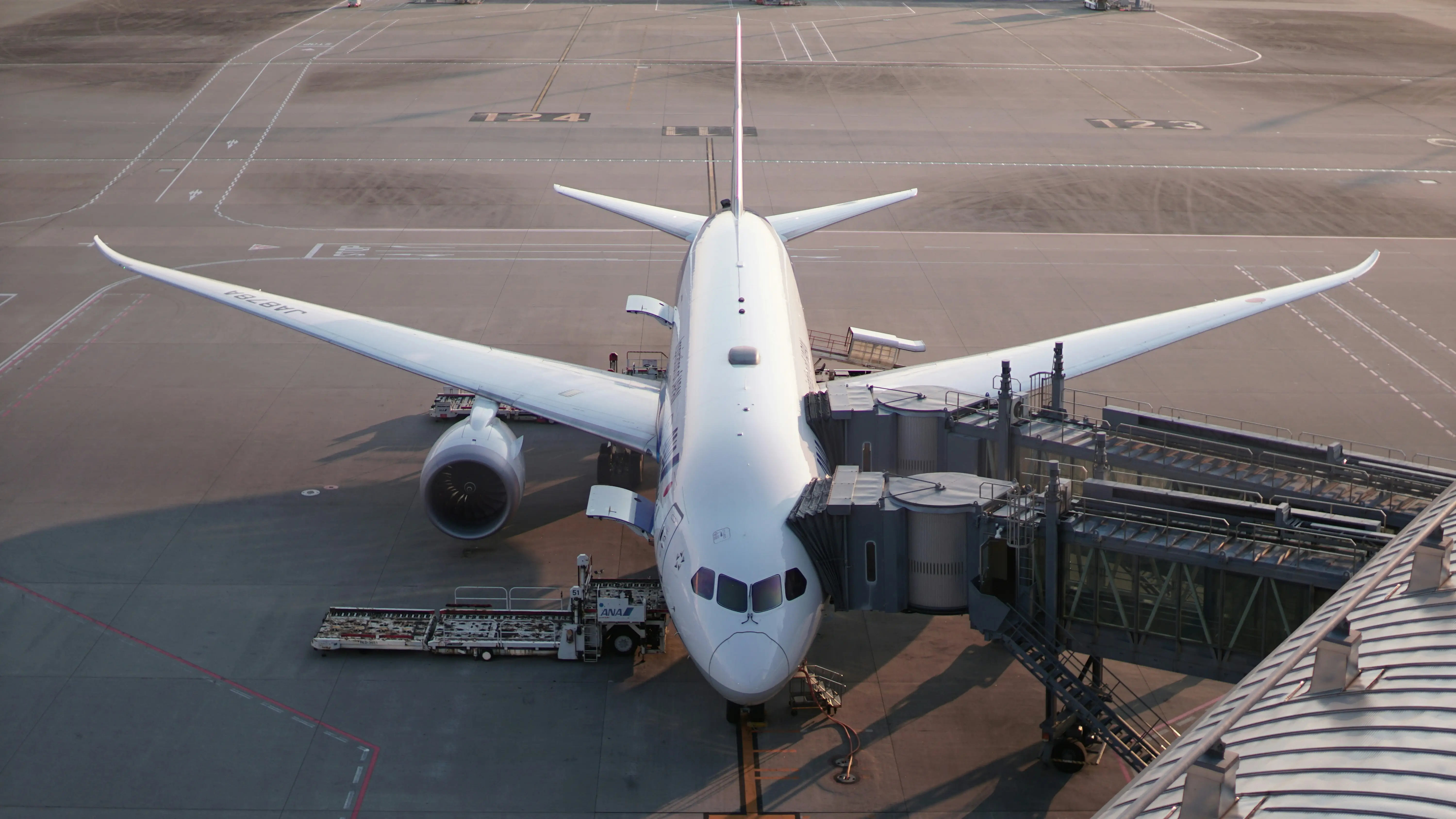 Commercial airplane at airport by Ern Low